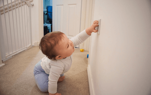 child playing with plug socket